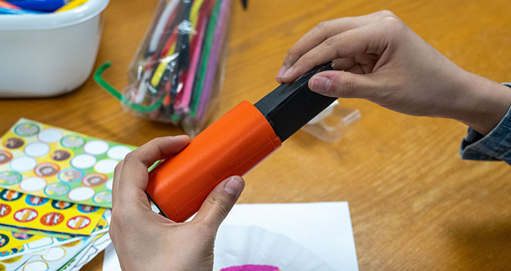 Insert the triangular tube into the decorated round cardboard tube