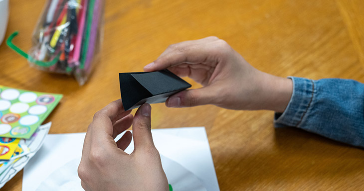 Fold the transparent paper and the black cardstock together