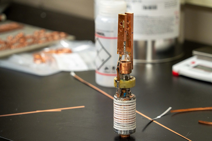 The white section at the bottom is the 720-feet of superconducting wire coiled tightly to carry electricity in the “Little Big Coil” magnet.